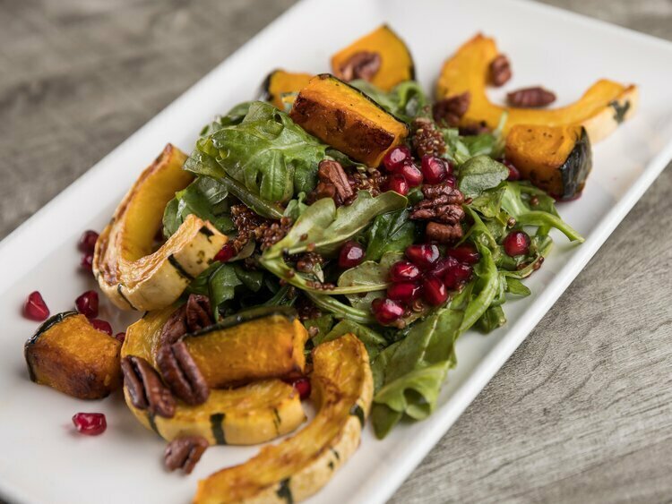 Arugula Salad with Roasted Delicata Squash, Pomegranate Seeds and Lemon Dijon Vinaigrette